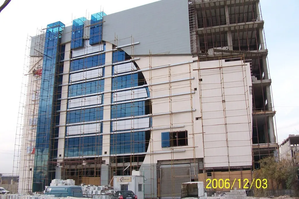 Commercial center facade with architectural blue glass curtain wall, Hawaii Home Center